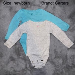 Two lace trimmed long sleeve onesies